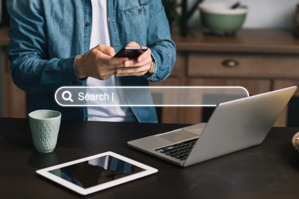 A person using multiple devices to establish an online presence for a rental business