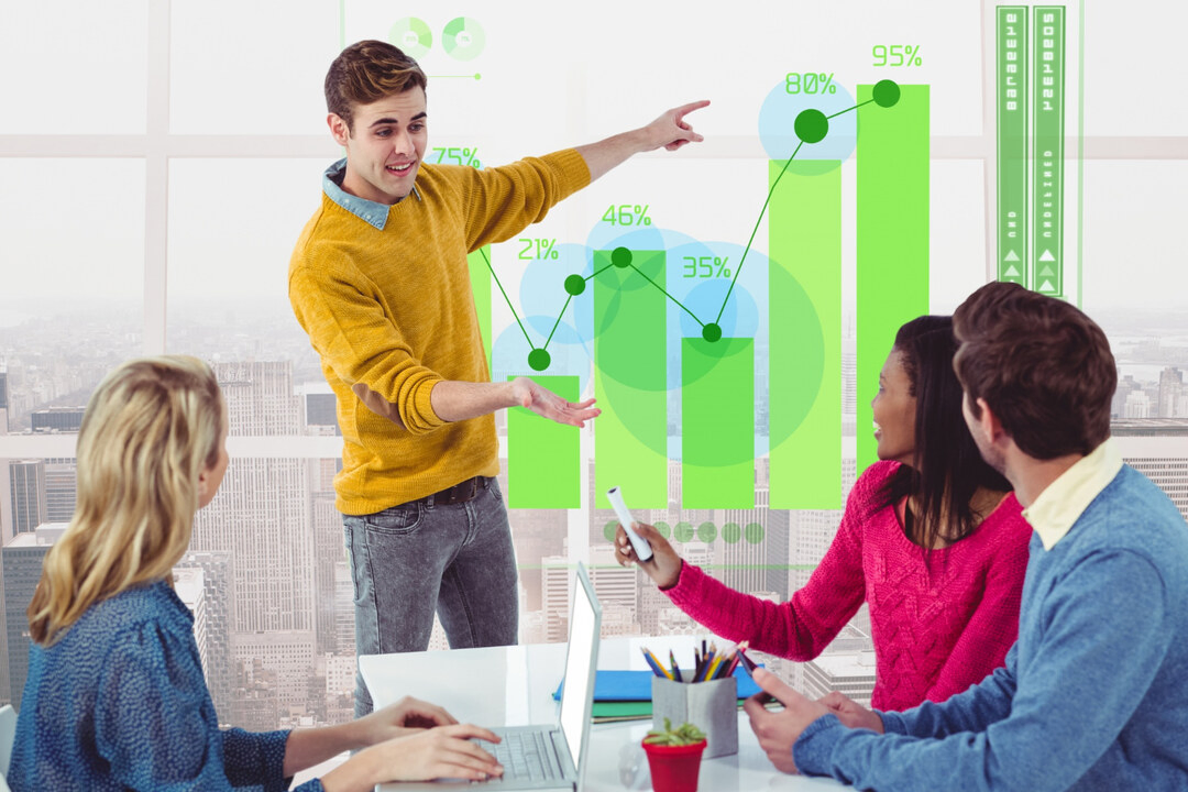 Team discussing green bar graphs, emphasizing strategies to grow a rental business.